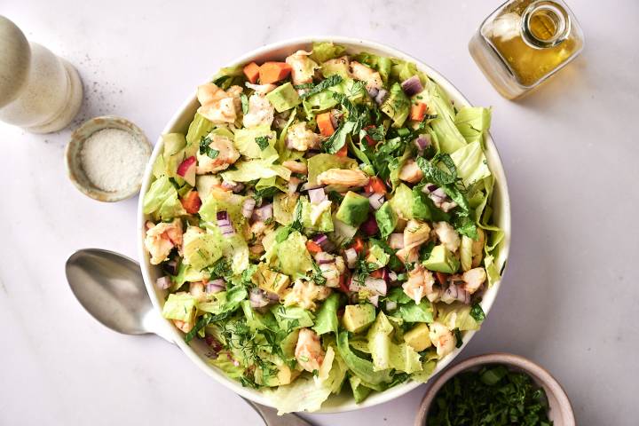 Chopped Shrimp Salad with Lemon Vinaigrette A top-down shot of a bowl of chopped shrimp salad, garnished with cilantro.