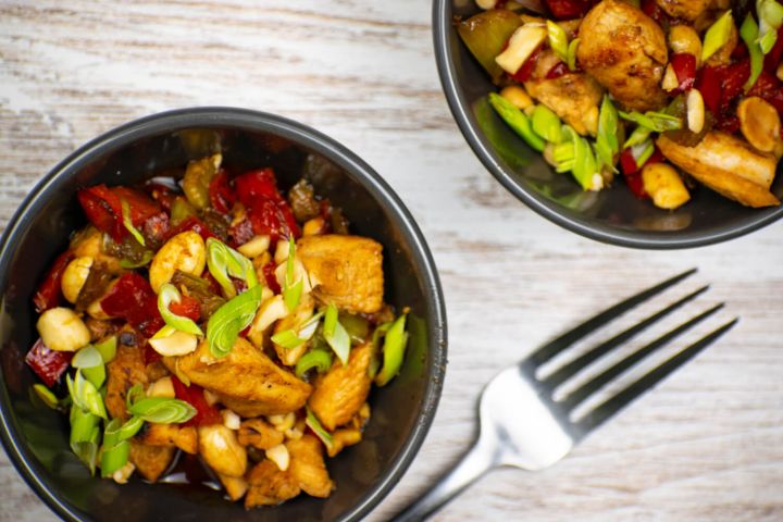 Low Carb and Paleo Kung Pao Chicken Low carb kung pao chicken with peppers, green onions, and cashews.