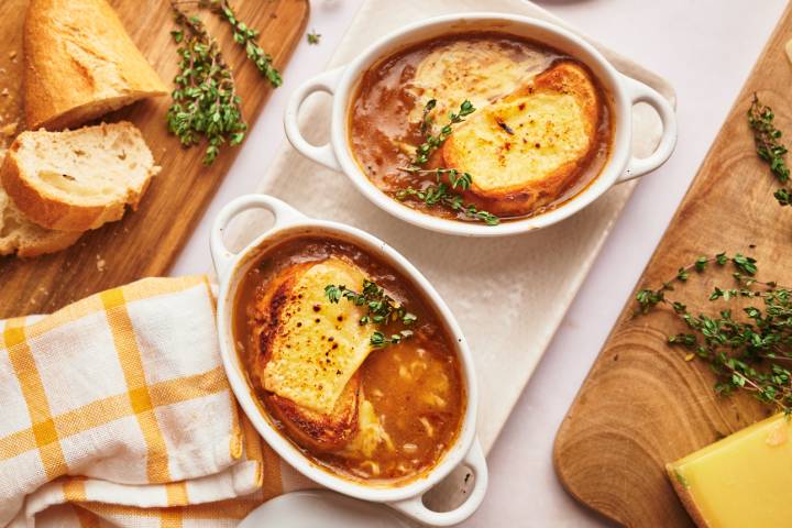 Slow Cooker French Onion Soup Slow Cooker French Onion soup in a bowl with bread and melted cheese.