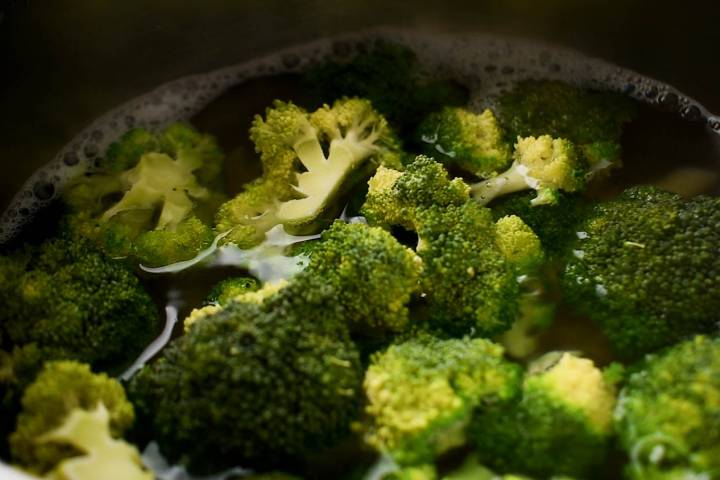 Lemon Broccoli Pasta Broccoli cooking in a large pot with pasta.