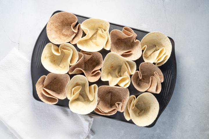 Taco Cups Tortillas pressed into a muffin tin.