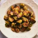 How to Cook Brussel Sprouts (+ 30 Recipe Ideas) Brussel sprouts that have been roasted in a white bowl.