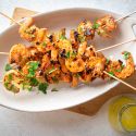 Garlic Grilled Shrimp Garlic grilled shrimp on wooden skewers with spices, lemon juice, and melted butter.