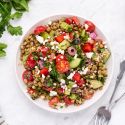 Easy Lentil Salad Easy lentil salad with Mediterranean flavors including olives, feta cheese, tomatoes, cucumbers, and fresh herbs in a bowl.