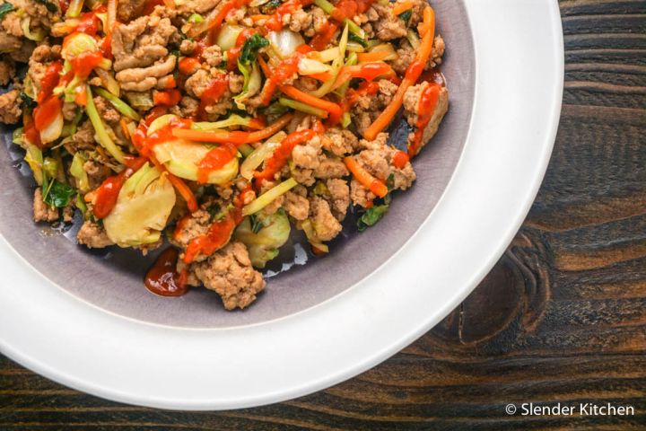 Whole30 Asian Ground Turkey Stir-fry Whole30 Asian turkey stir fry with shredded cabbage, carrots, broccoli, and Brussels sprouts in a garlic, ginger, and soy based sauce.