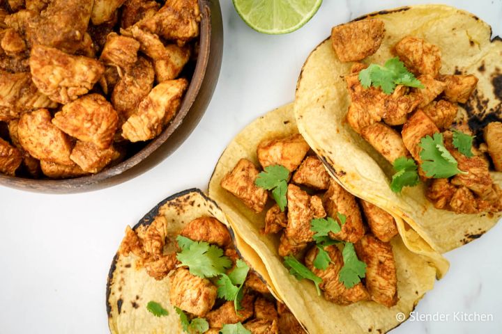 Easy Chicken Soft Tacos Chicken soft tacos with seasoned chicken breast and cilantro served on corn tortillas.