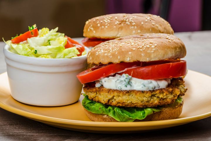 Chickpea Feta Burgers Chickpea burgers made with feta cheese topped with yogurt sauce, lettuce, and tomatoes.