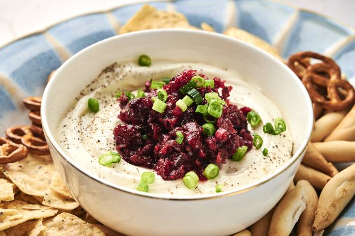 Cranberry Jalapeño Cream Cheese Dip Cranberry jalapeno cream cheese dip sitting in a bowl.