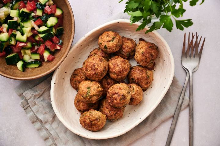 Healthy Greek Meatballs Greek meatballs with cucumber salad and tzatziki.