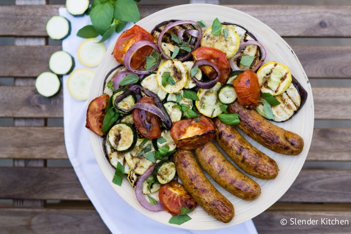 Grilled Chicken Sausages and Vegetables Grilled chicken sausage with vegetables on a plate.