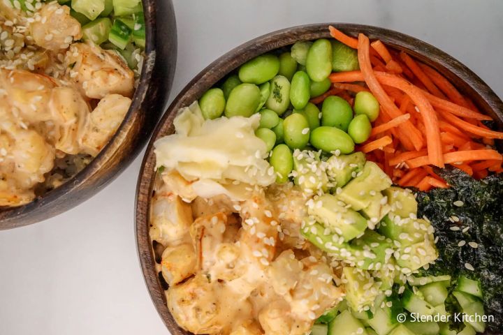 Low Carb Shrimp Sushi Bowl Sushi bowls with shrimp, cauliflower rice, avocado, cucumbers, and carrots.