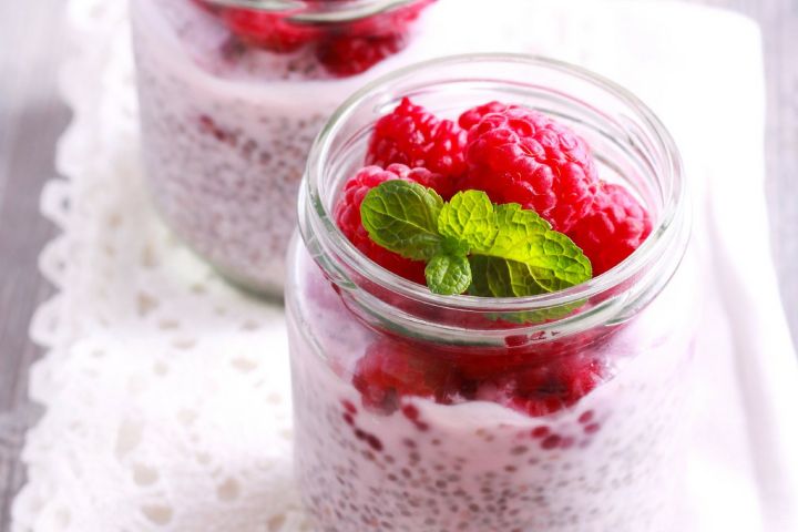Low Carb Oatmeal with Flax and Chia Low carb chia and flaxseed oatmeal in a glass jar with raspberries.