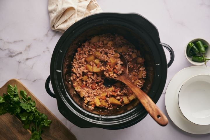 Slow Cooker Picadillo Slow cooker picadillo with ground meat, potatoes, and carrots with a spicy tomato sauce.