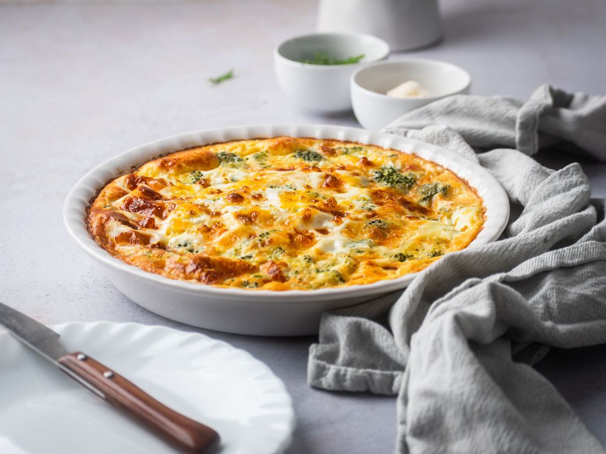 Healthy 250 Calories Recipes Ham and Cheese Frittata with Broccoli Freshly Made on a White Plate