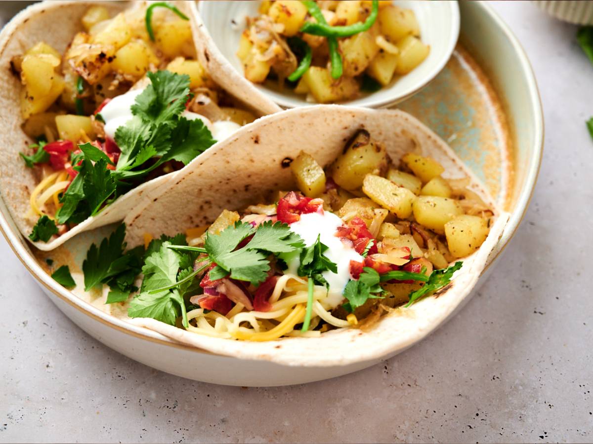 Vegetarian Tacos Potato green chile tacos with chopped potatoes, poblano peppers, onions, and salsa served in corn tortillas.