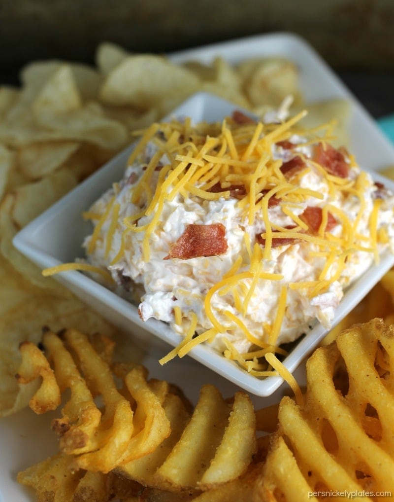 Loaded Baked Potato Dip only has three ingredients and is perfect for game day snacking. If you love loaded baked potatoes, you'll love dipping your chips or potato wedges into this simple dip! | www.persnicketyplates.com