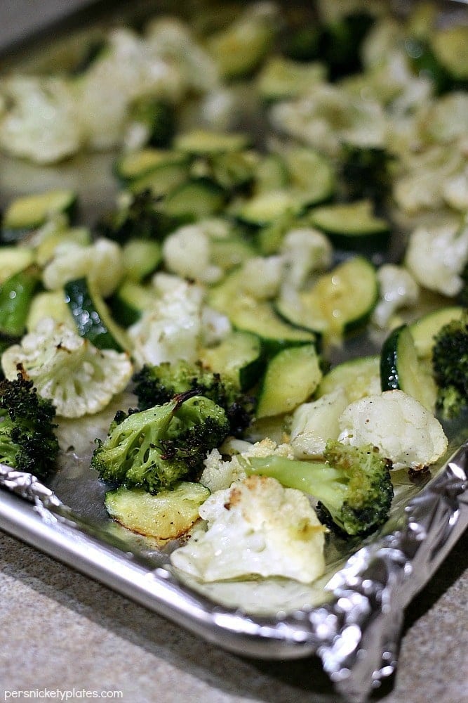 Simple blend of roasted broccoli, cauliflower, and zucchini flavored with dollops of Marzetti Lemon Basil finishing sauce. | Persnickety Plates AD