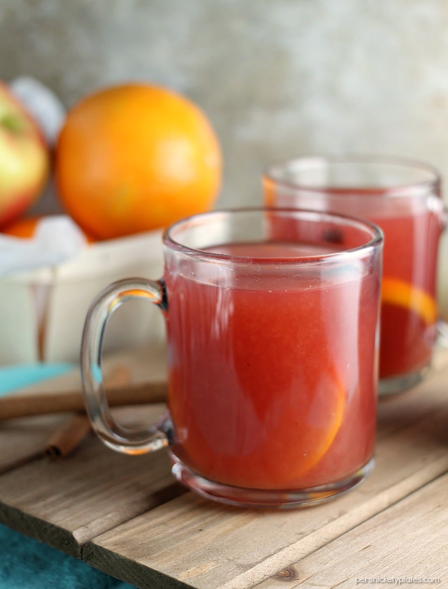 two glass mugs of cider.