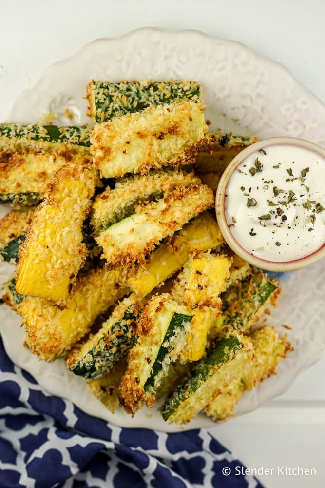 Zucchini and summer squash recipe with breadcrumbs and garlic on a plate.