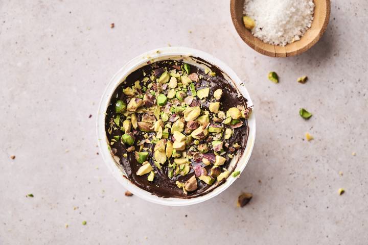  A top-down shot of several finished Dubai chocolate yogurt cups.