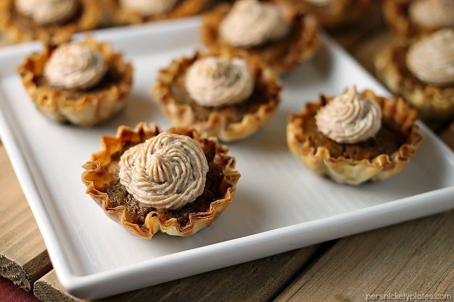 close up of 5 mini sweet potato pies on white square plate