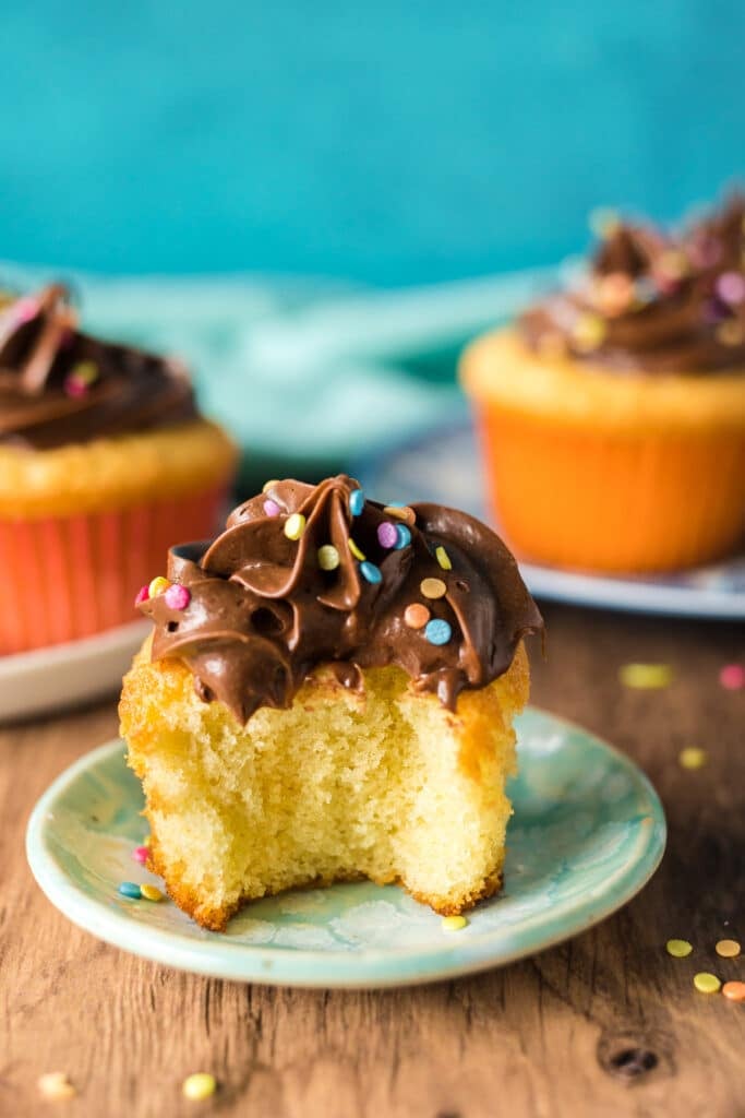 yellow cupcake with a bite missing.