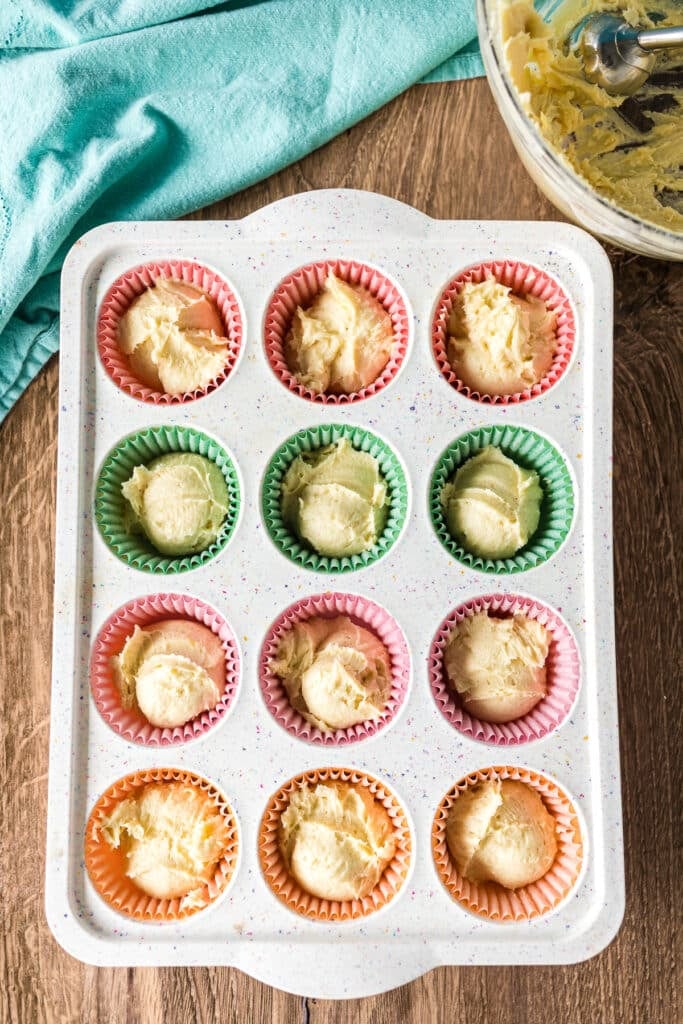 overhead shot of cupcake batter in a cupcake pan.