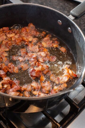Bacon being sauteed
