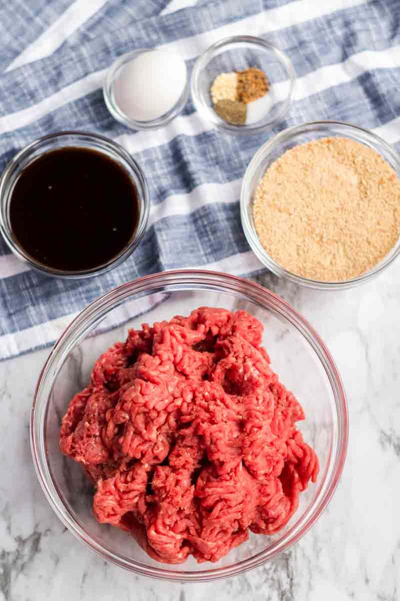 Classic Meatloaf with Brown Gravy for those nights you're feeling nostalgic and want an easy, filling meal. | www.persnicketyplates.com ground sirloin and seasonings prepped to make meatloaf