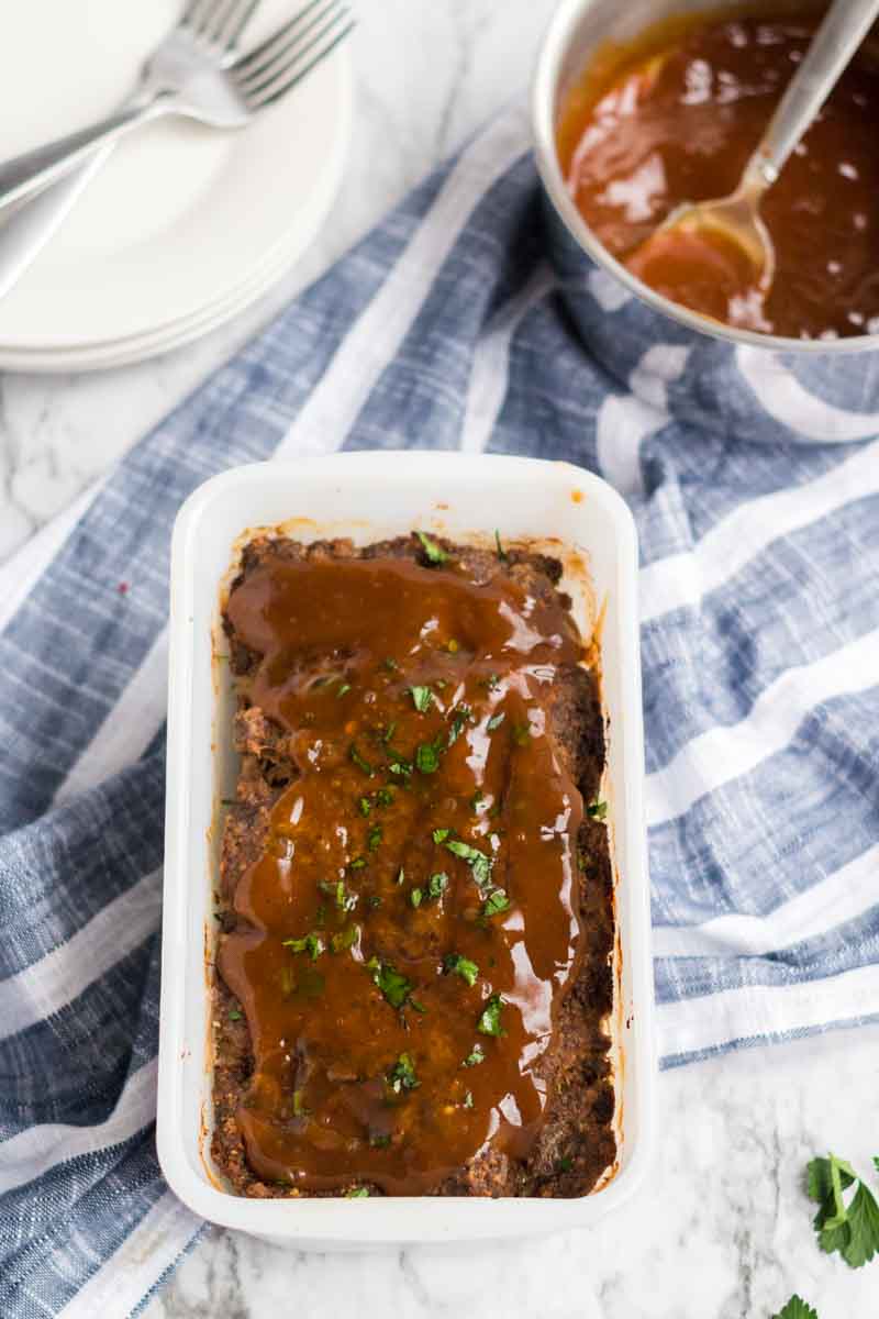 Classic Meatloaf with Brown Gravy for those nights you're feeling nostalgic and want an easy, filling meal. | www.persnicketyplates.com meatloaf with brown gravy in loaf pan