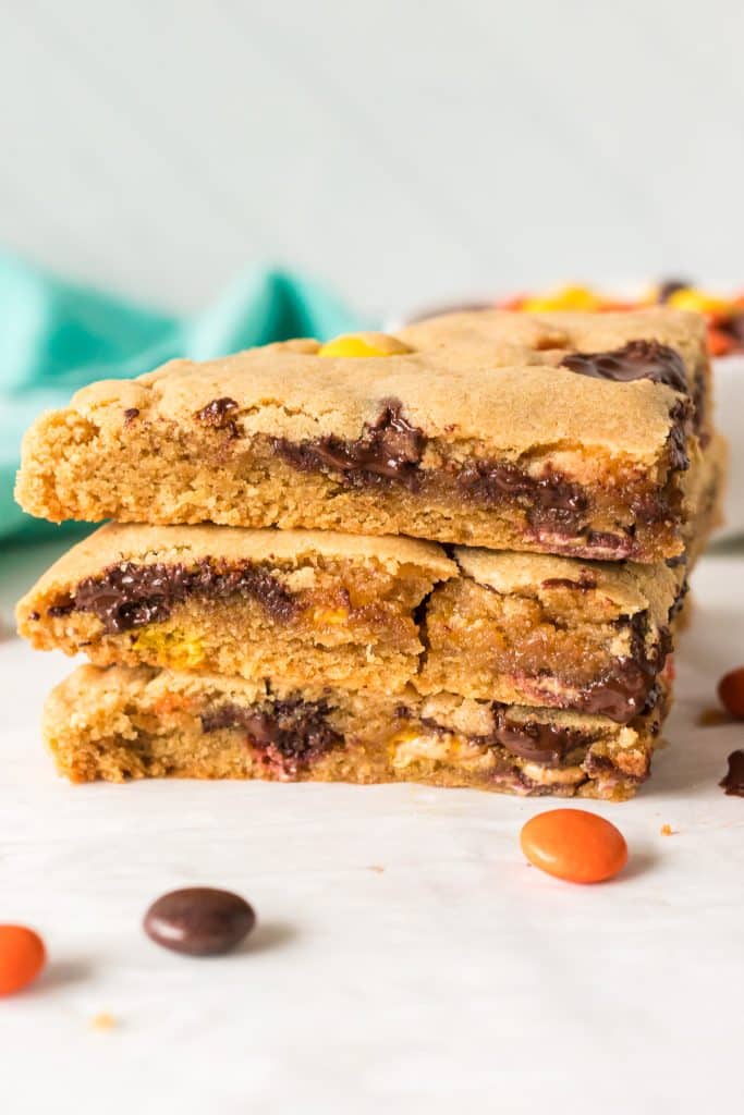 stack of 3 pieces of a melty, gooey peanut butter cookie.