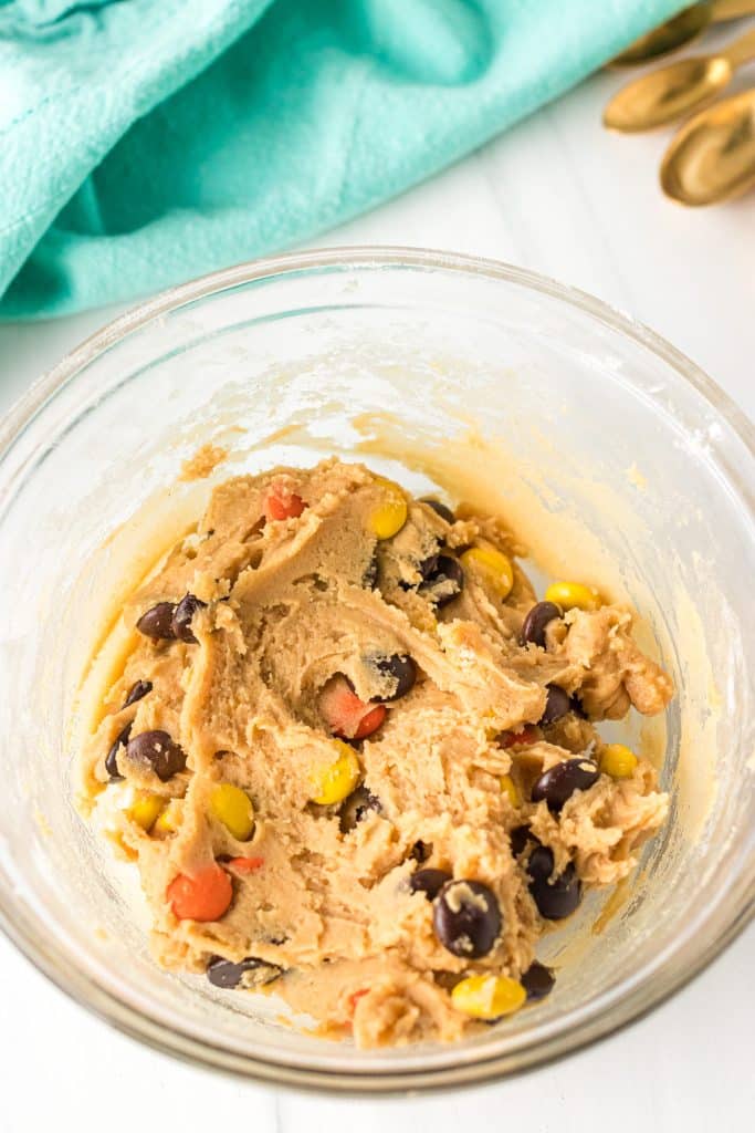 overhead shot of peanut butter cookie dough in a mixing bowl.