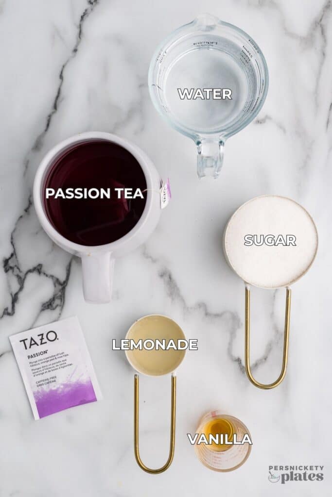 Ingredients for passion tea lemonade: brewed tea, water, sugar, vanilla, and lemonade in measuring cups.