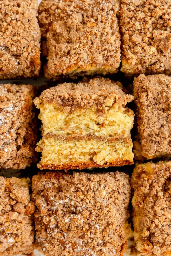 sliced coffee cake with one piece turned sideways.