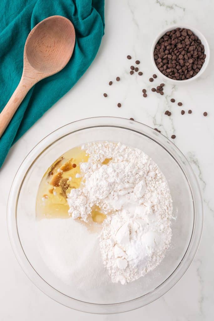 overhead shot of glass mixing bowl filled with dry ingredients.