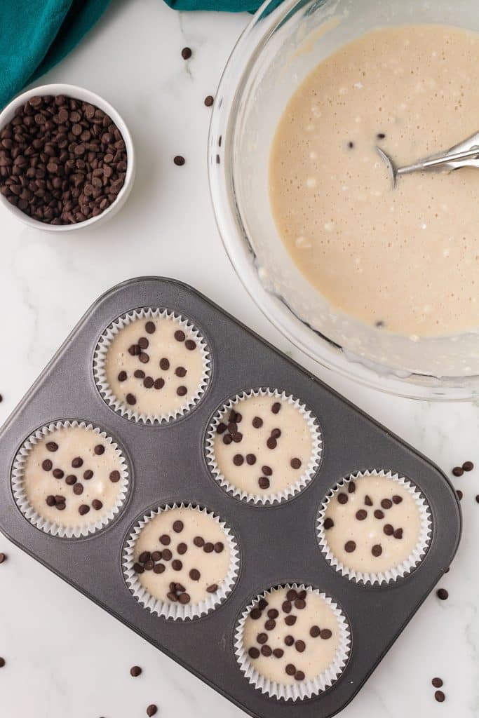 overhead shot of muffin tray filled with muffin batter.