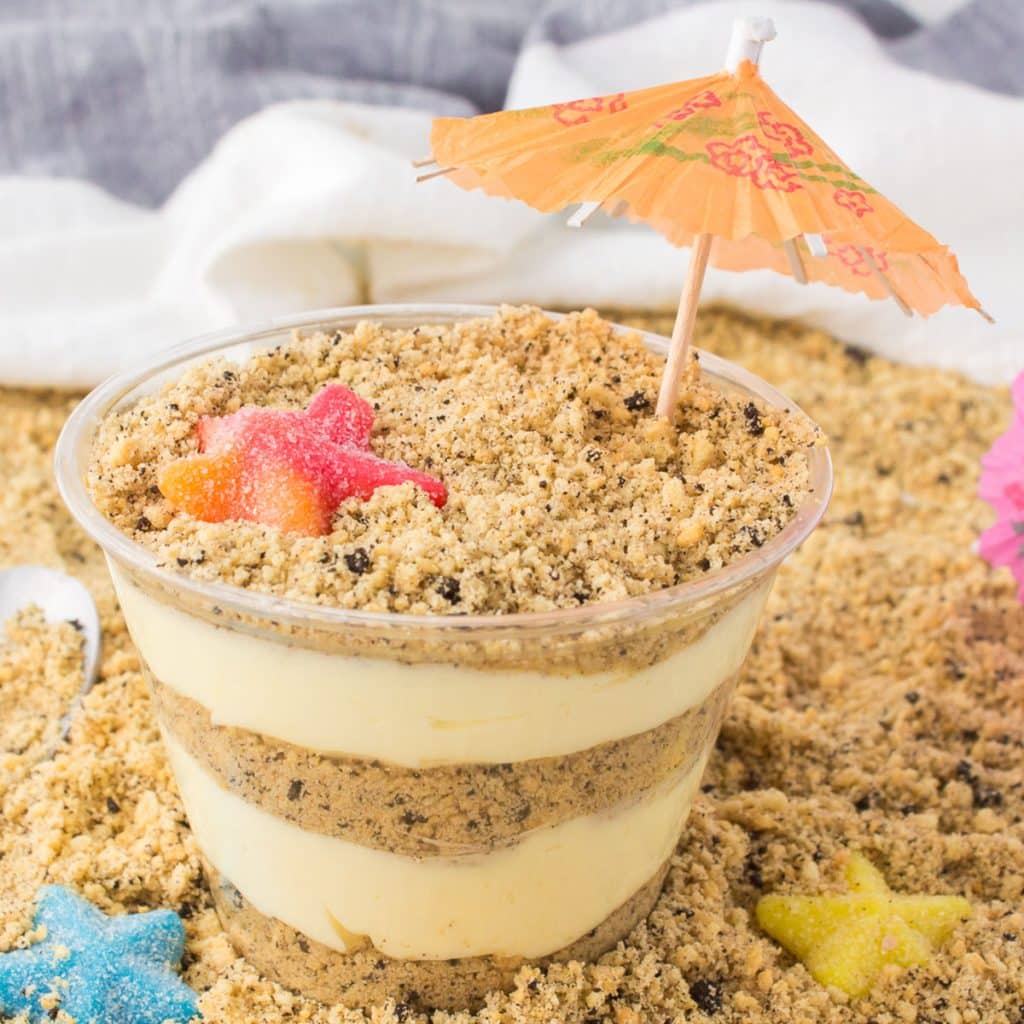 layered sand pudding cup with a drink umbrella.