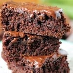 Zucchini Brownies are moist and chocolaty with a simple frosting. They also happen to be dairy-free/vegan. You'll never know there's zucchini hidden in them! | www.persnicketyplates.com