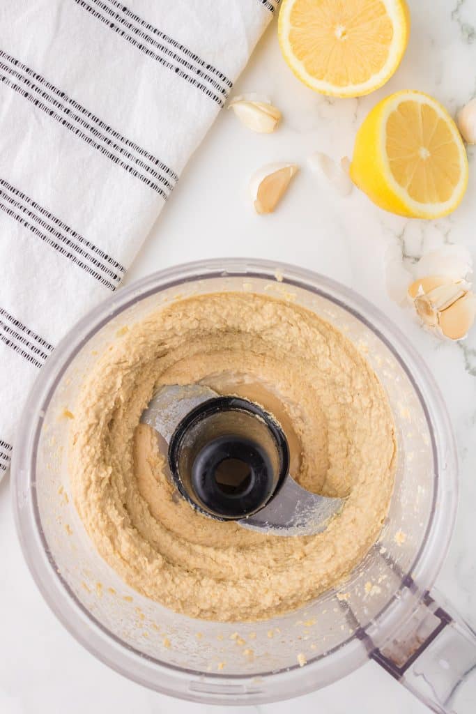 overhead shot of hummus in a food processor.