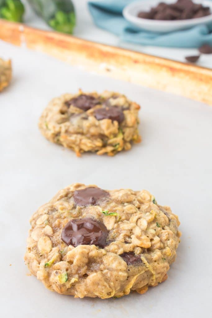 freshly baked a zucchini oatmeal cookie on a baking sheet.
