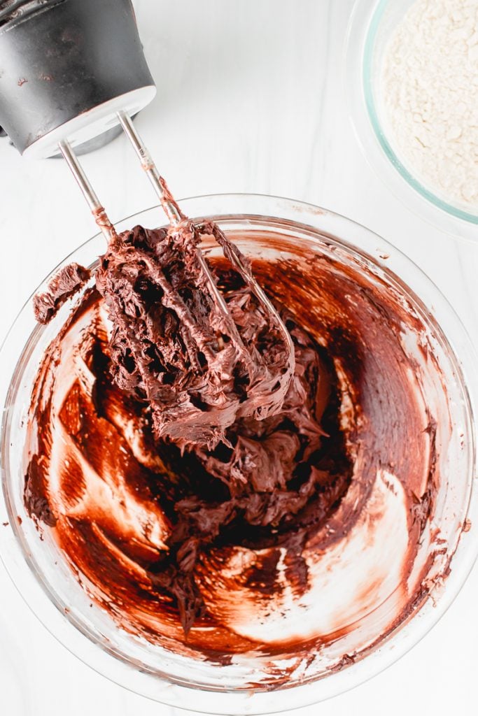 overhead shot of mixer beaters with chocolate batter