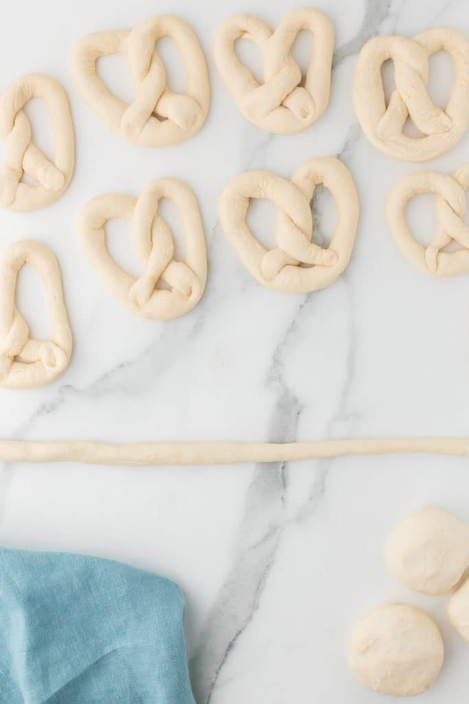 dough rolled into a skinny log to make a pretzel.