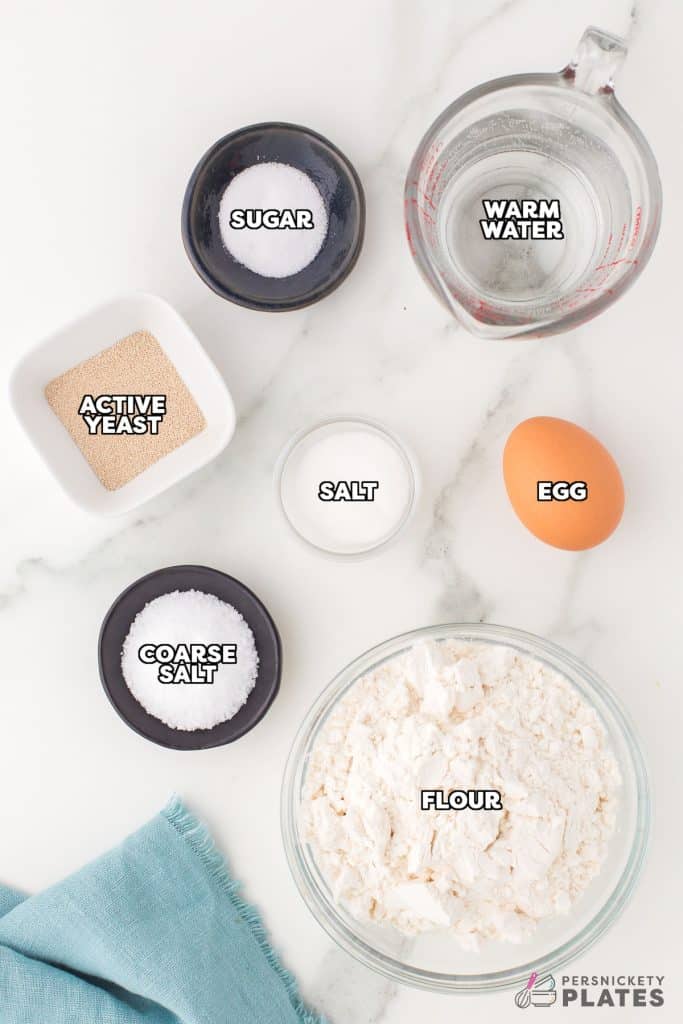 overhead shot of labeled ingredients laid out to make homemade soft pretzels.