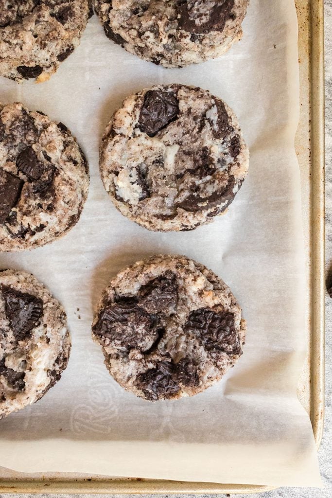 overhead shot of oreo cheesecake cookies on a baking sheet.