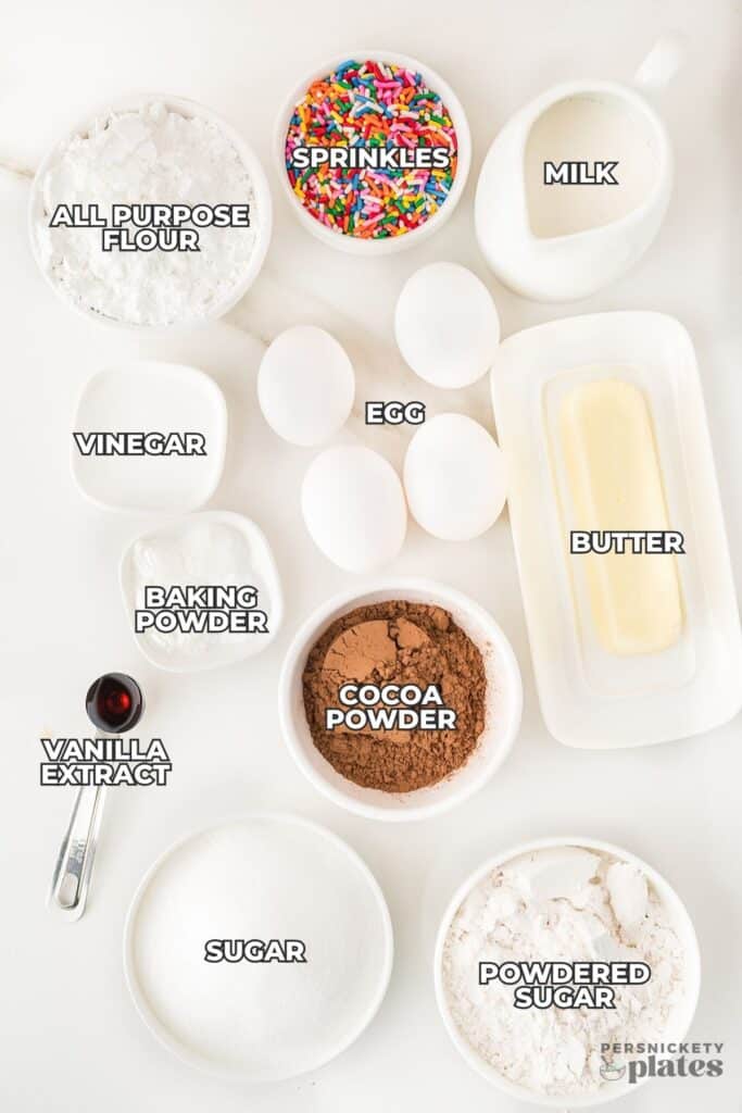 overhead shot of labeled ingredients laid out to make a yellow cake from scratch.