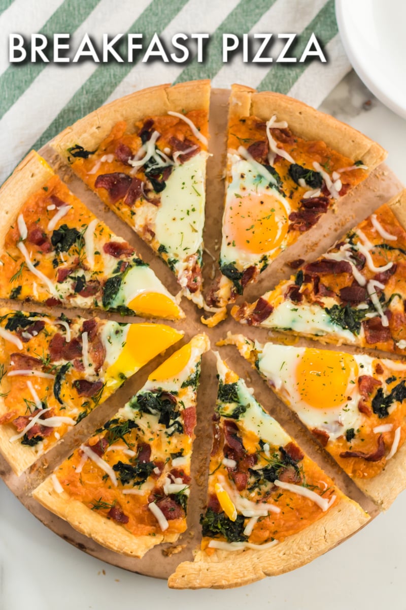 Bacon & spinach breakfast pizza is a filling and unique way to start your day. Pizza for breakfast is always a good idea! | www.persnicketyplates.com #pizza #breakfast #breakfastpizza #easyrecipe full breakfast pizza sliced