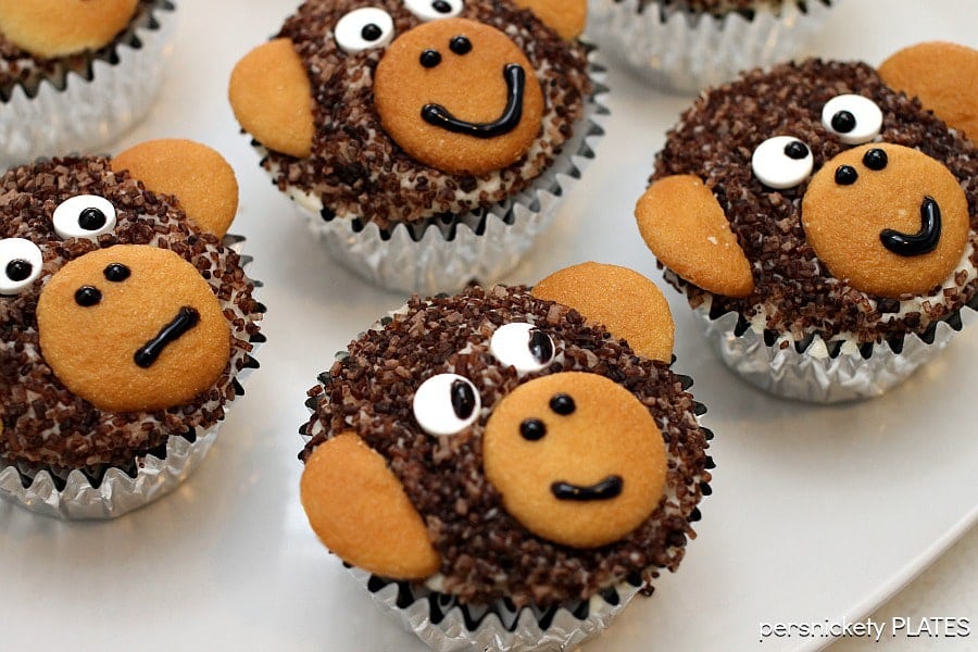 Monkey Cupcakes are such a cute dessert idea, you may not want to eat them! These delicious homemade chocolate cupcakes are made with chocolate sanding sugar and vanilla wafer ears! Perfect for a monkey themed birthday party!