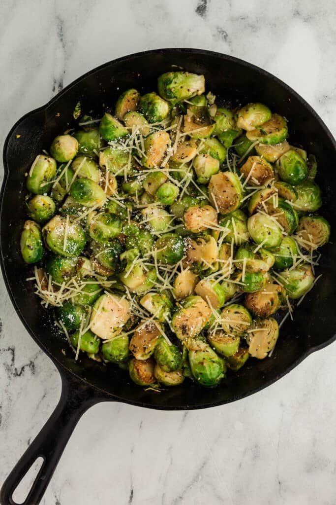 skillet of garlic parmesan brussels sprouts.