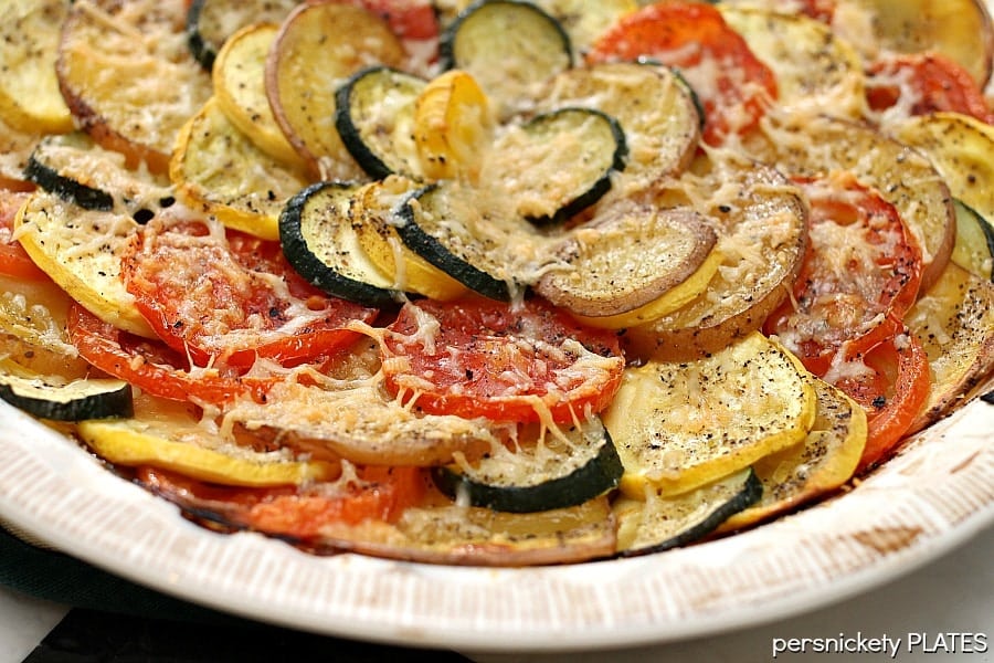 colorful roasted veggies in a round white dish
