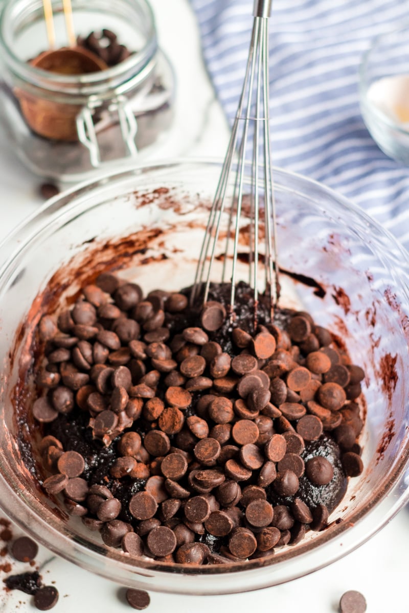 Coconut Oil Dark Chocolate Brownies are made with coconut oil instead of butter. Only 6 simple ingredients in these "from scratch" brownies - give them a shot! | www.persnicketyplates.com coconut oil brownies ingredients in mixing bowl with whisk